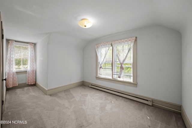 bonus room with light colored carpet, a baseboard heating unit, and lofted ceiling