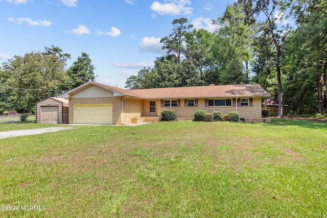 single story home with a front lawn and a garage