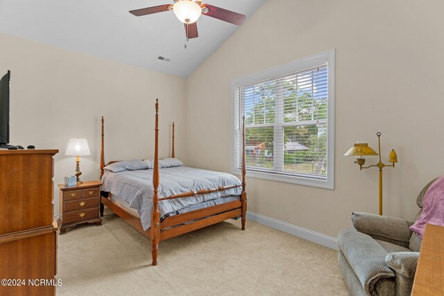 carpeted bedroom with lofted ceiling and ceiling fan