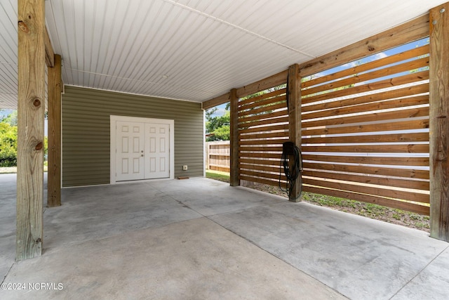 garage featuring a carport