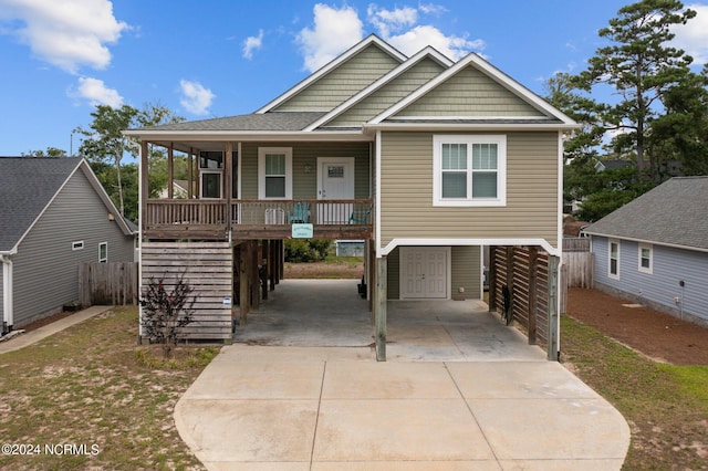 view of front facade with a porch and a carport