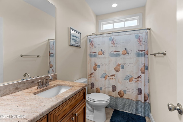 bathroom with vanity, a shower with curtain, and toilet