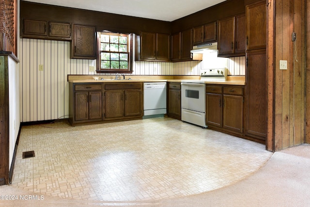 kitchen with visible vents, light countertops, a sink, white appliances, and under cabinet range hood