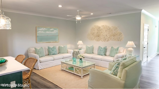 living room featuring ceiling fan, dark hardwood / wood-style floors, and ornamental molding