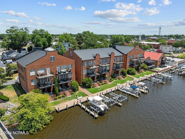 drone / aerial view with a water view and a residential view