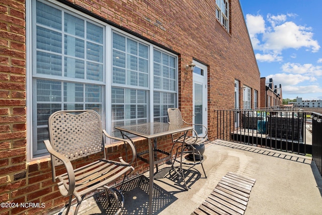 view of patio with a balcony