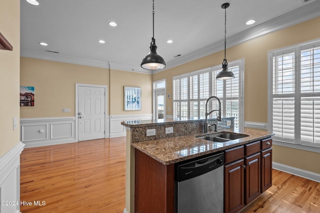 kitchen featuring light wood-type flooring, stainless steel dishwasher, crown molding, sink, and decorative light fixtures