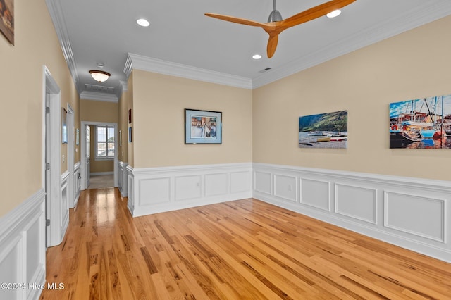 spare room featuring crown molding, recessed lighting, visible vents, light wood-style floors, and a ceiling fan