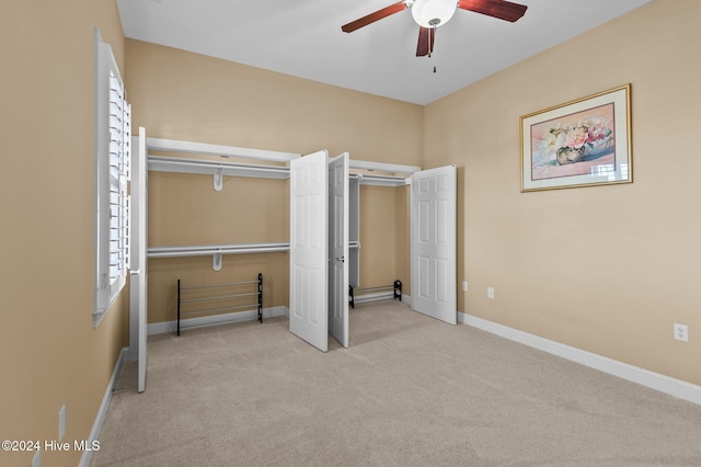 unfurnished bedroom featuring ceiling fan, carpet floors, and baseboards