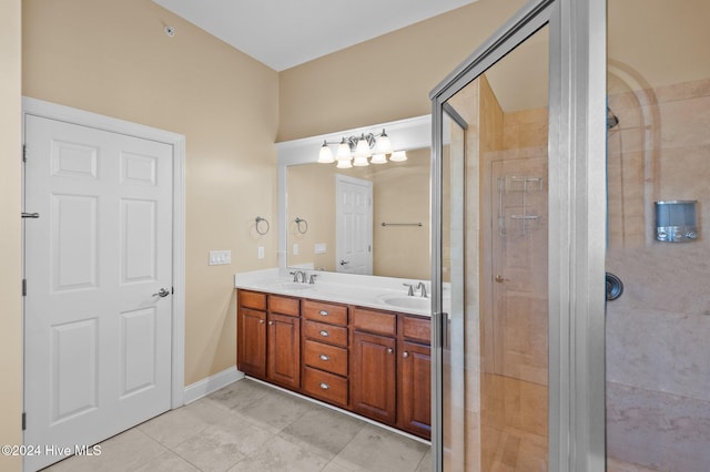 bathroom featuring tile patterned flooring, vanity, and an enclosed shower