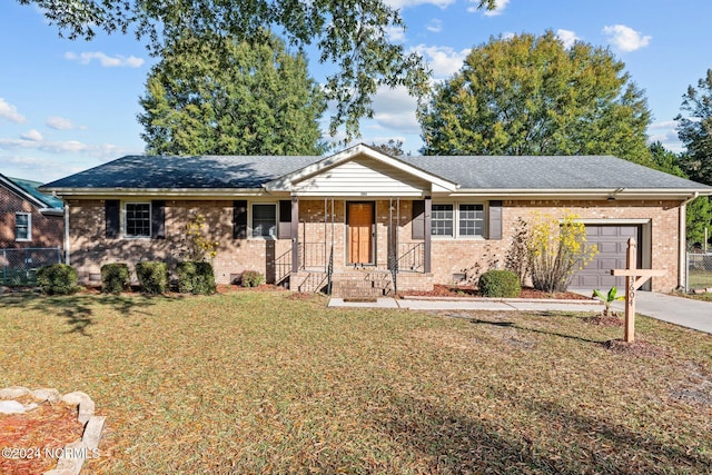 3604 Yarmouth Rd, New Bern, NC 28562 - single story home with a garage, brick siding, driveway, and roof with shingles