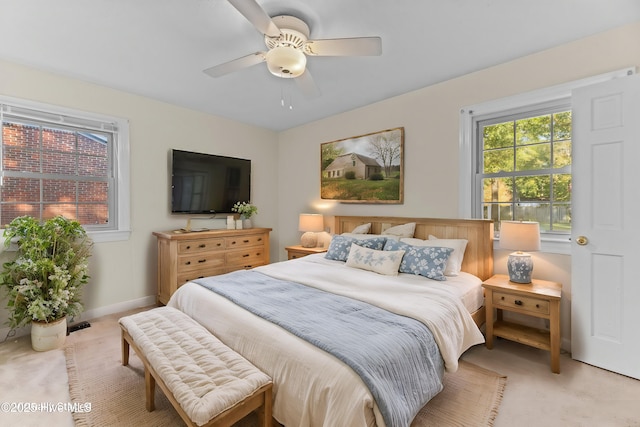 bedroom featuring ceiling fan and light colored carpet