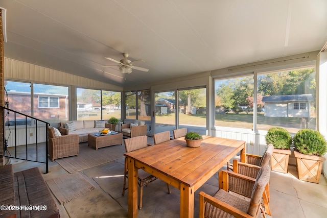 sunroom featuring ceiling fan, plenty of natural light, and vaulted ceiling