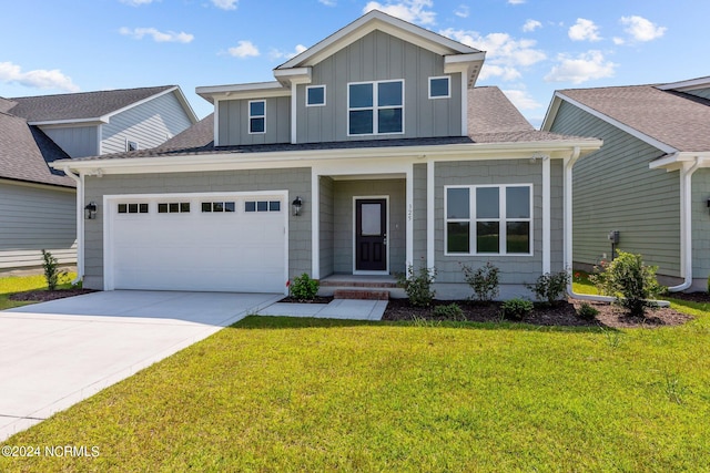 view of front facade with a front yard and a garage