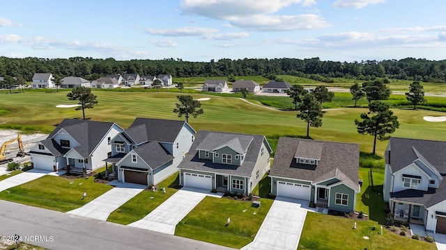 birds eye view of property with view of golf course and a residential view