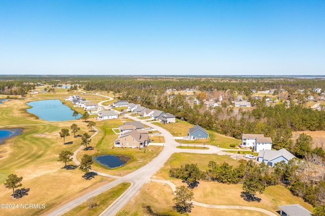 bird's eye view featuring a water view and a residential view