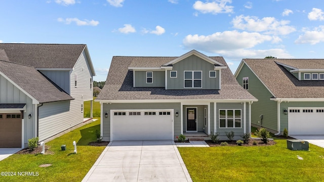 view of front of home featuring concrete driveway, roof with shingles, covered porch, board and batten siding, and a front yard