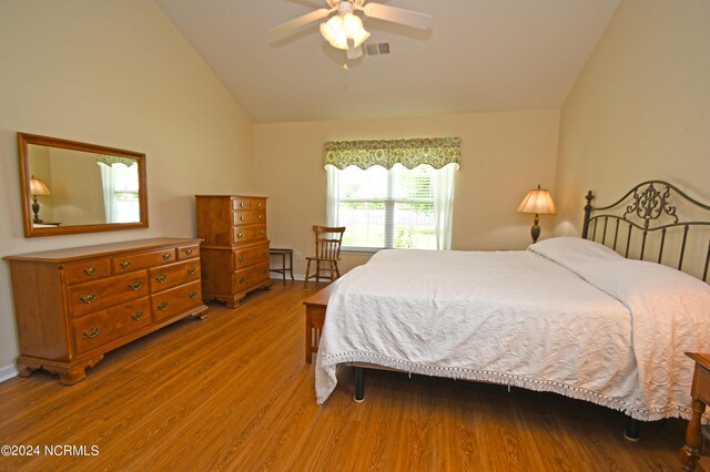 bedroom with high vaulted ceiling, light hardwood / wood-style flooring, and ceiling fan