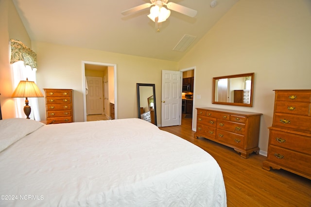 bedroom with connected bathroom, ceiling fan, high vaulted ceiling, and wood-type flooring