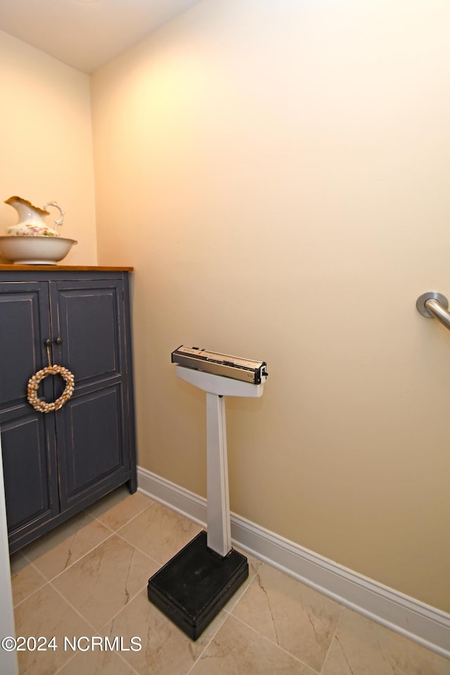 bathroom with tile patterned floors