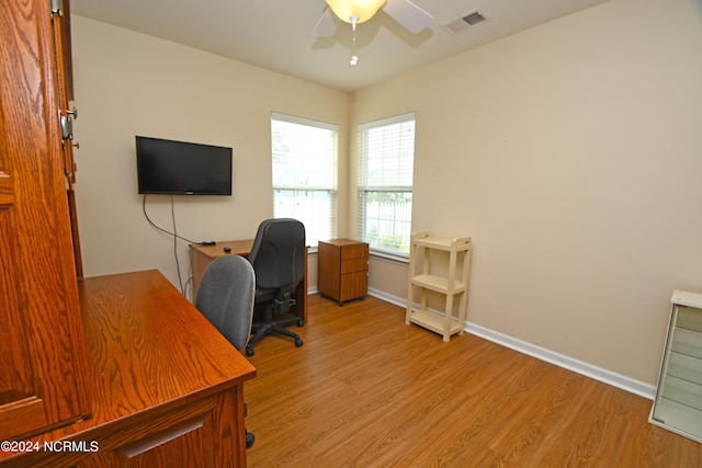 office space featuring ceiling fan and light wood-type flooring