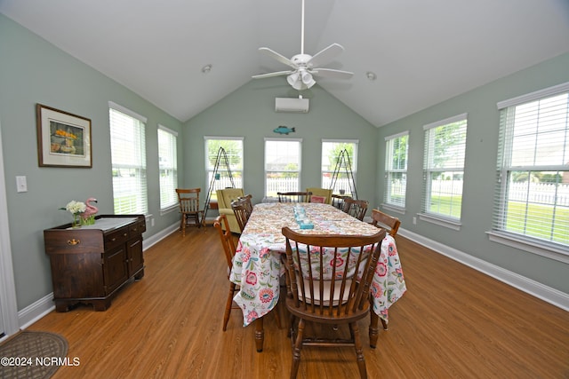 dining area with vaulted ceiling, light hardwood / wood-style flooring, ceiling fan, and an AC wall unit