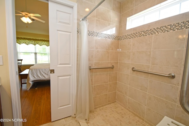 bathroom with a shower with curtain and ceiling fan