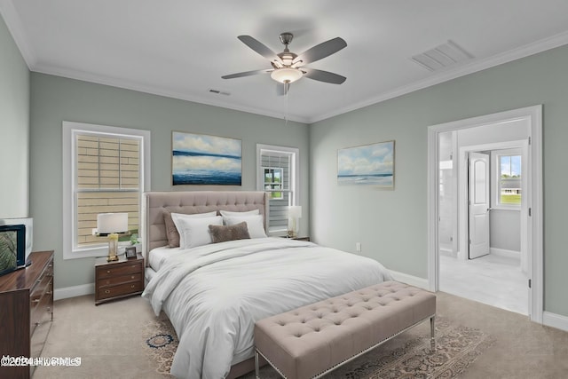 carpeted bedroom with ceiling fan and ornamental molding