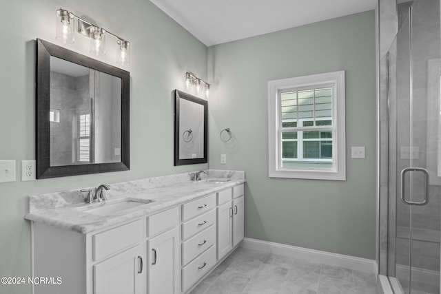 bathroom featuring tile patterned flooring, vanity, and an enclosed shower