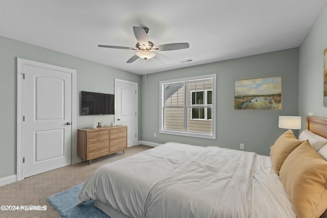 carpeted bedroom with ceiling fan