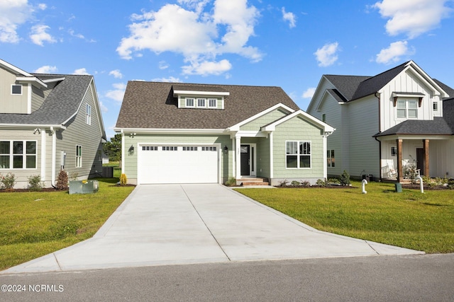 view of front facade featuring a front yard and a garage