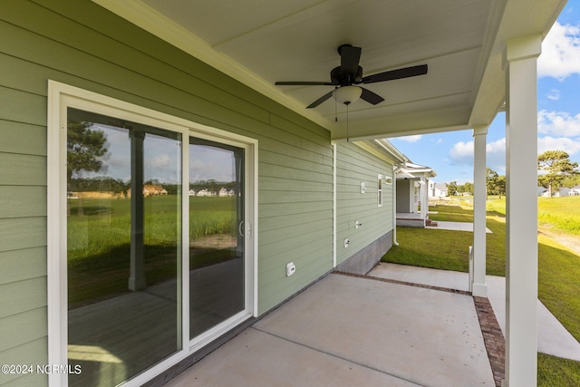 view of patio featuring ceiling fan