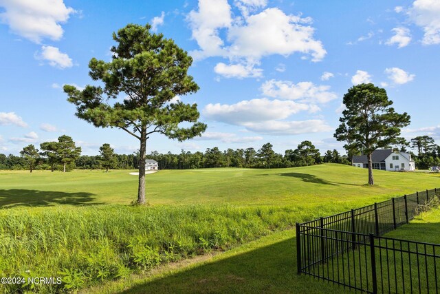 view of home's community with a lawn