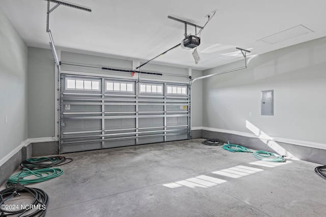 garage with electric panel and a garage door opener