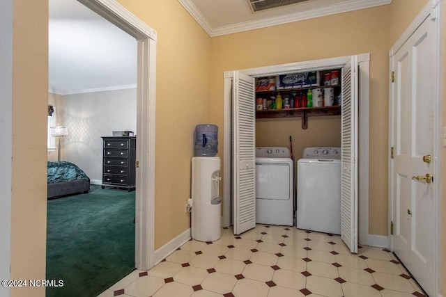 clothes washing area featuring laundry area, baseboards, washer and dryer, ornamental molding, and light floors