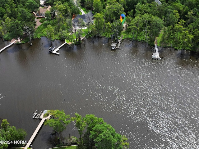 birds eye view of property featuring a water view