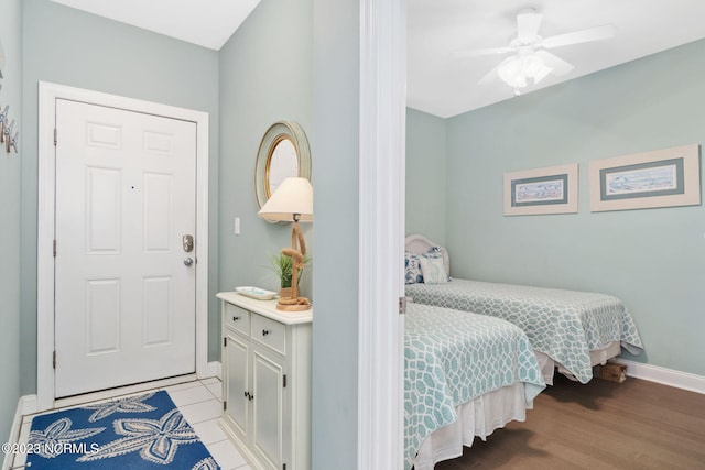 bedroom with ceiling fan and light wood-type flooring