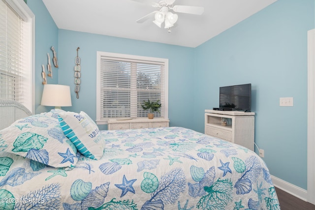 bedroom with hardwood / wood-style flooring and ceiling fan