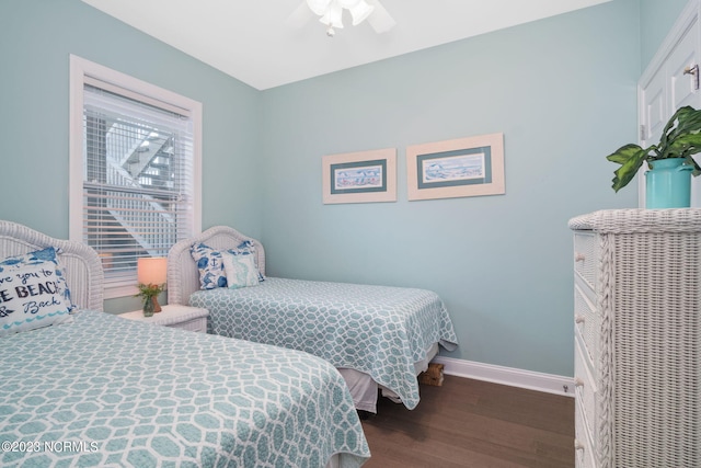 bedroom featuring dark hardwood / wood-style floors and ceiling fan