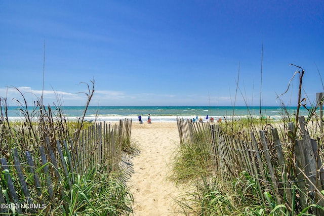 property view of water featuring a beach view