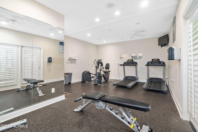 gym with ceiling fan and a wealth of natural light