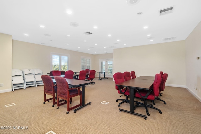 dining space with light carpet