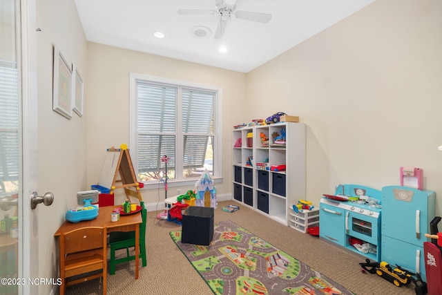 game room with carpet and ceiling fan