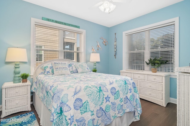 bedroom with dark wood-type flooring