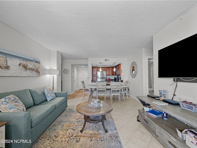 tiled living room with a textured ceiling