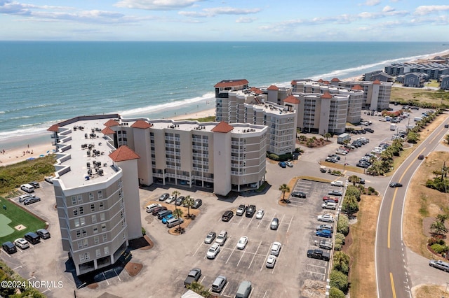 aerial view featuring a water view and a beach view