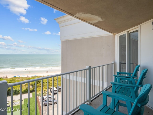 balcony with a view of the beach and a water view