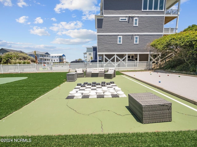 view of swimming pool featuring outdoor lounge area, a yard, and a patio