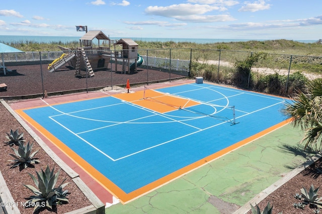 view of sport court featuring a playground