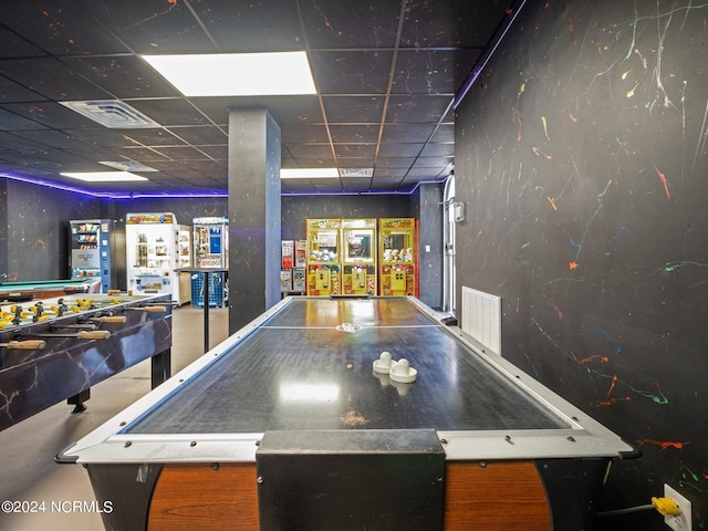 playroom with a paneled ceiling